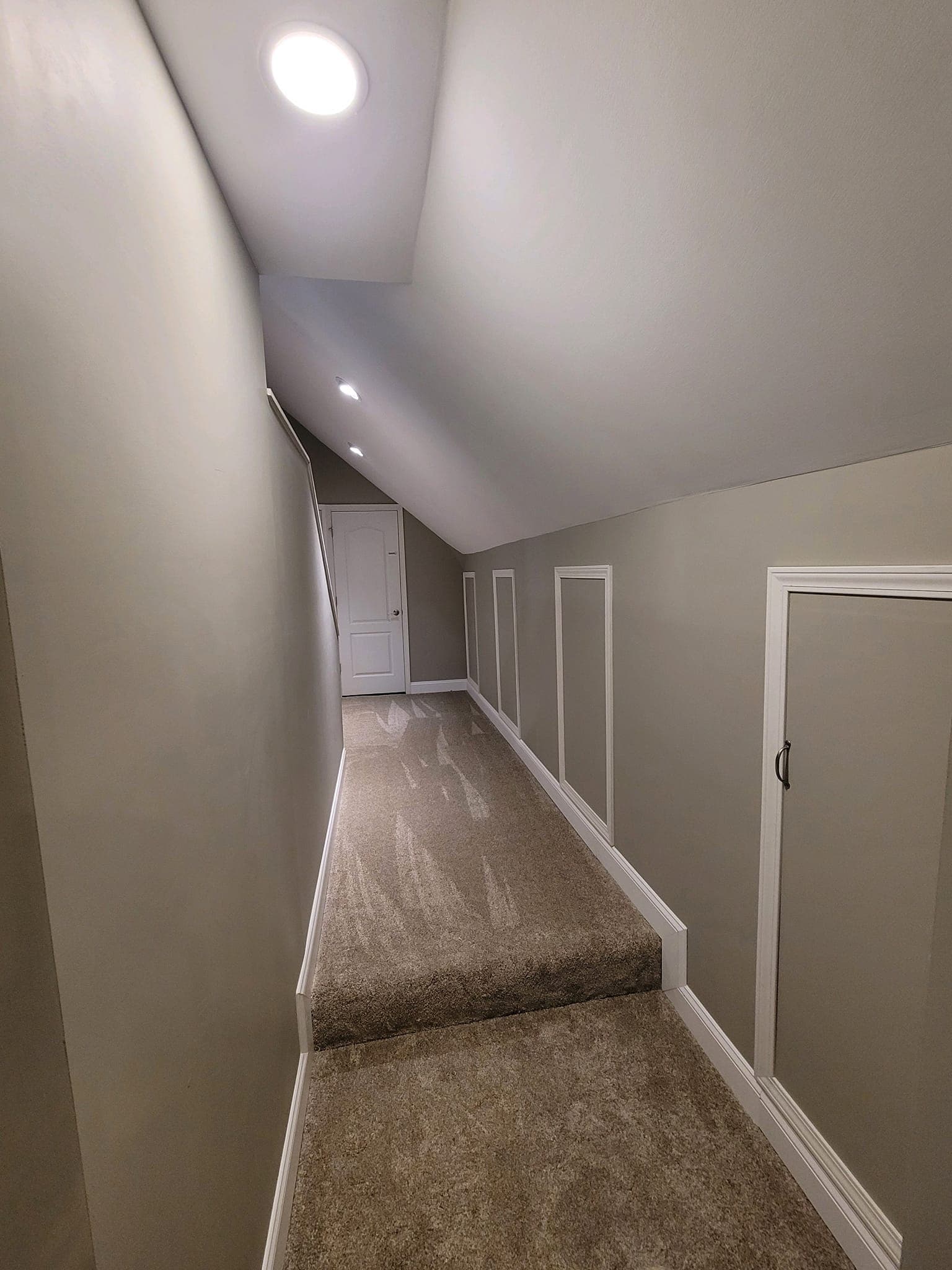 Carpet Hallway with Skylight